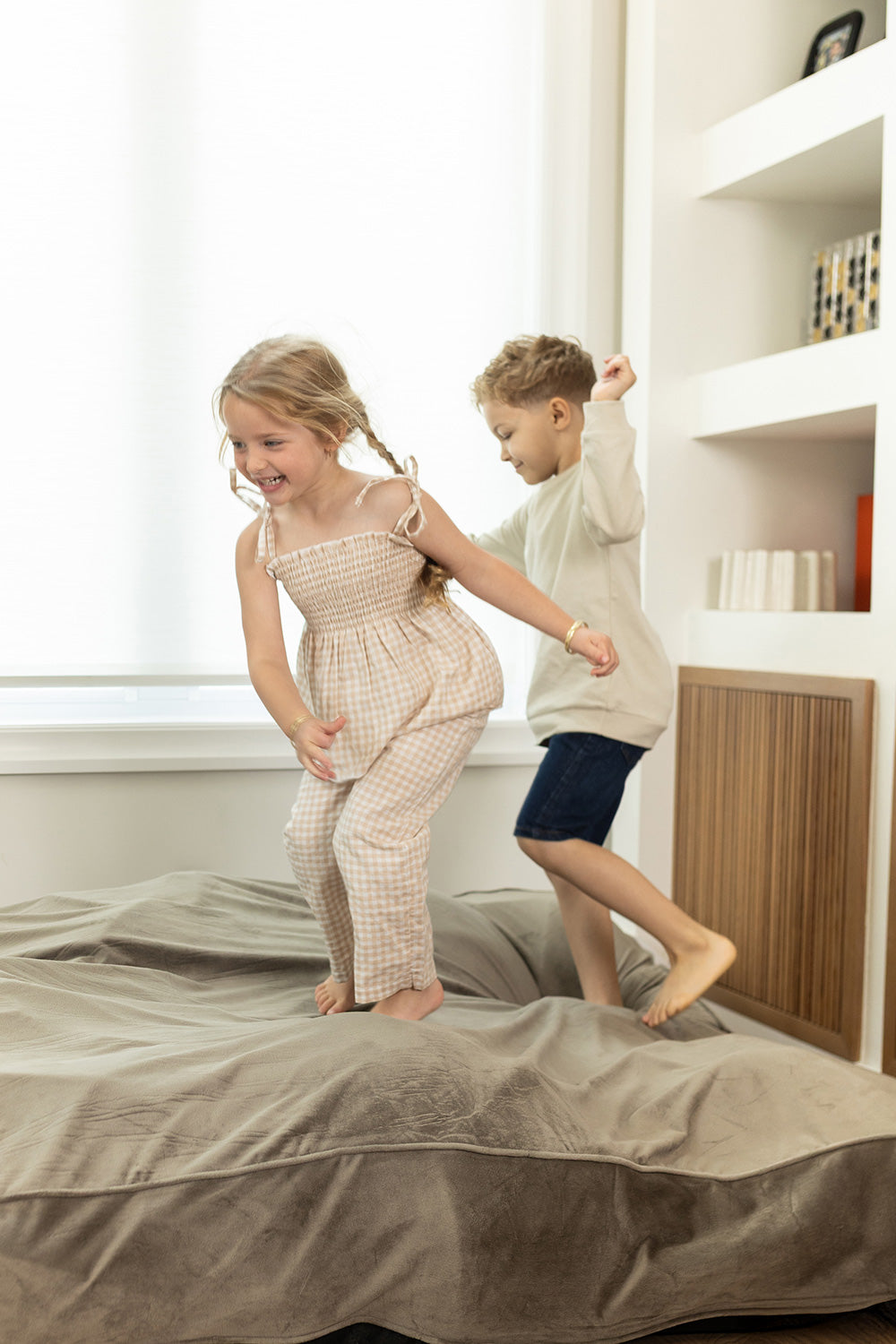children jumping on crash pad