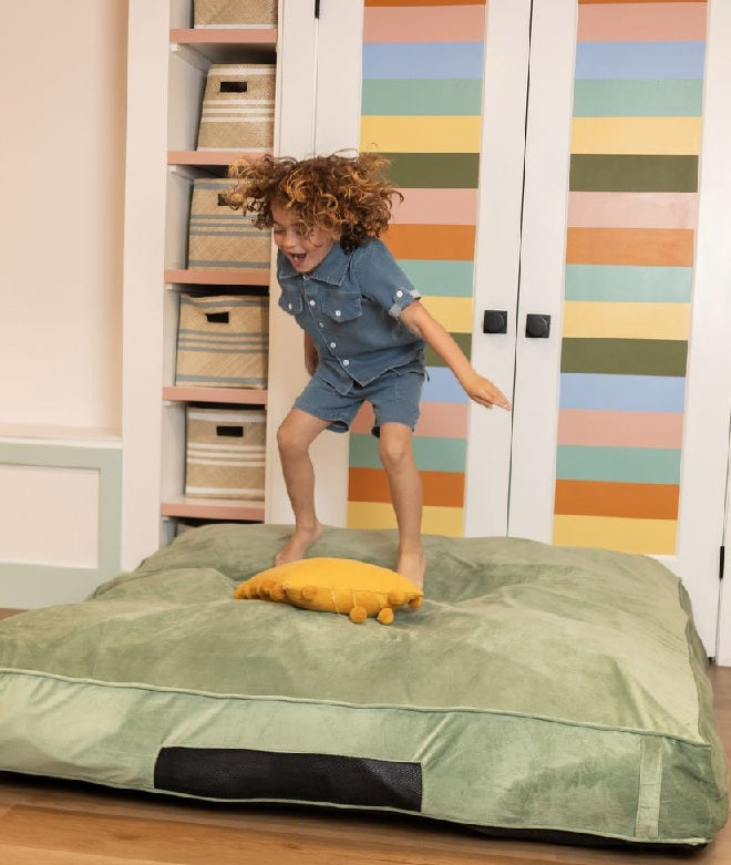 Child jumping on crash pad