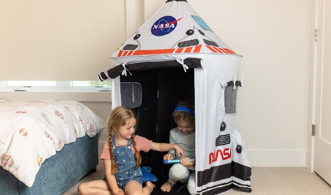 Children playing in space tent