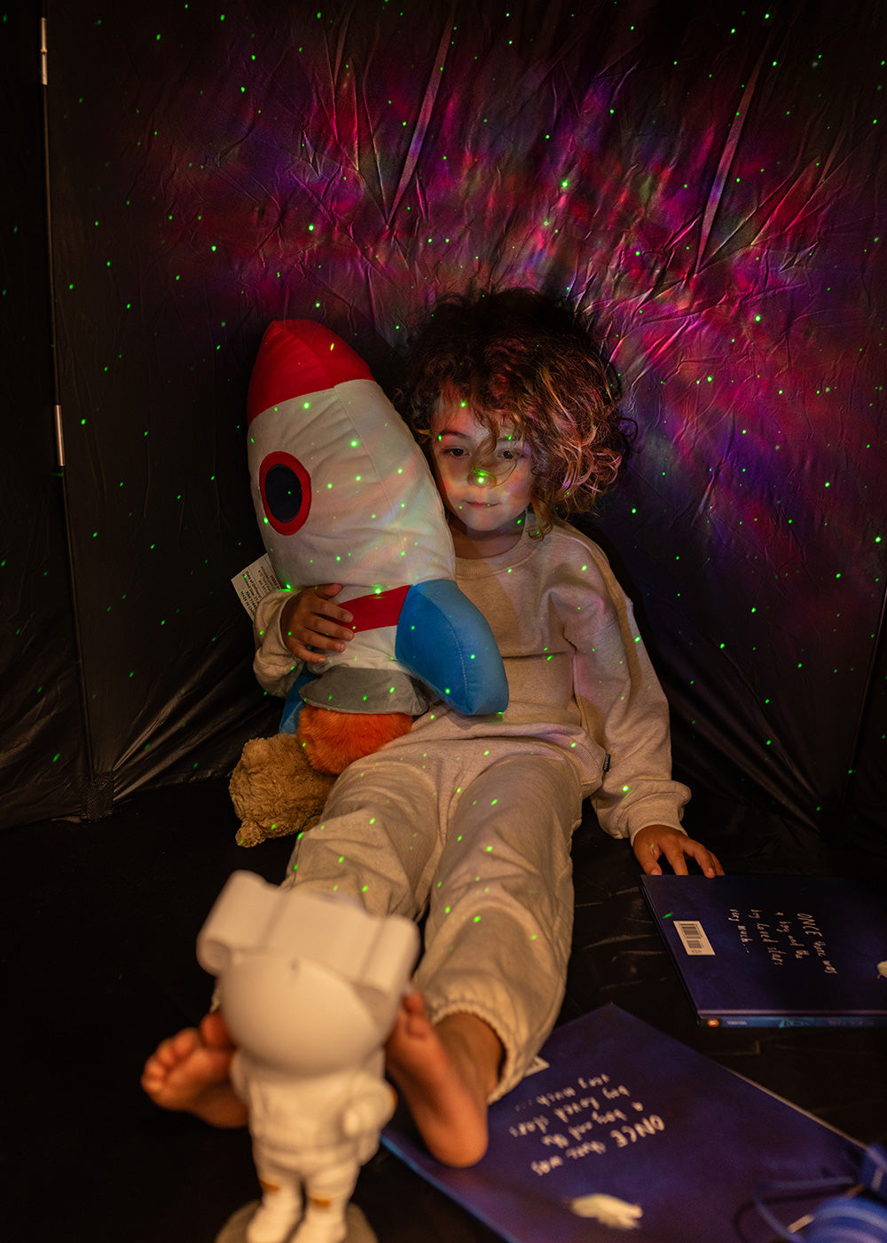 boy relaxing in space tent