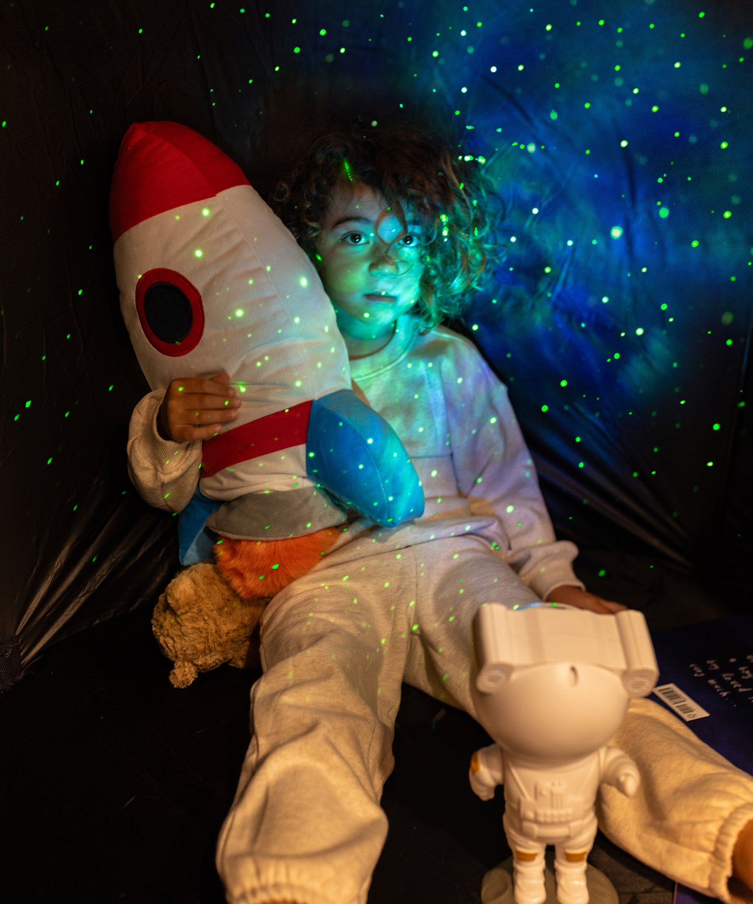 Astronaut light projector & young boy