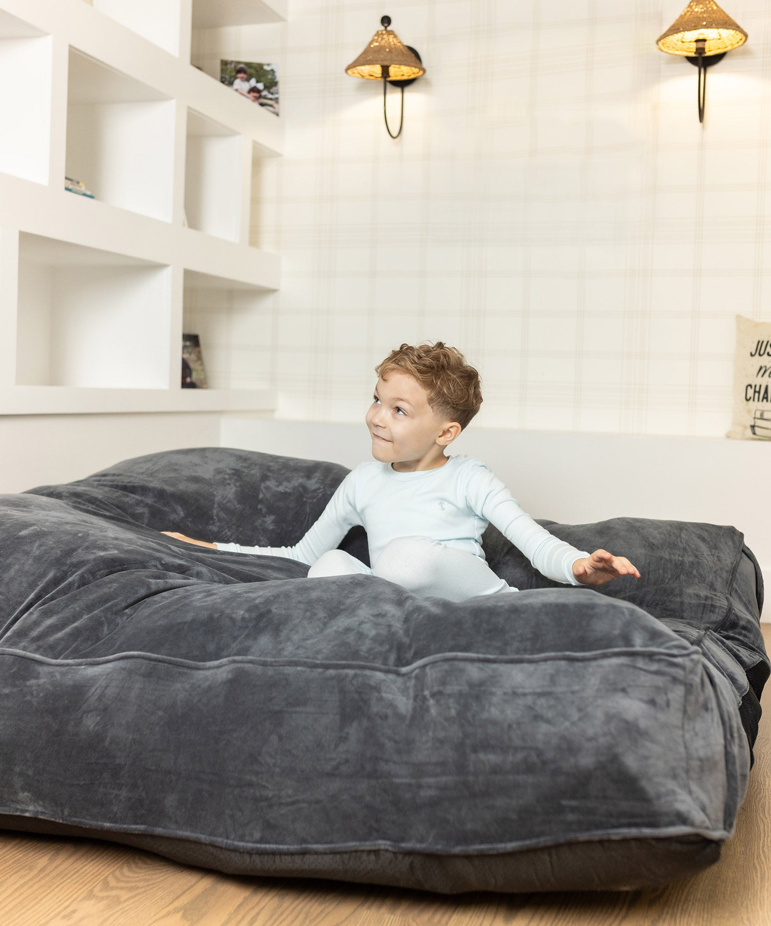 Boy playing on Grey crash pad