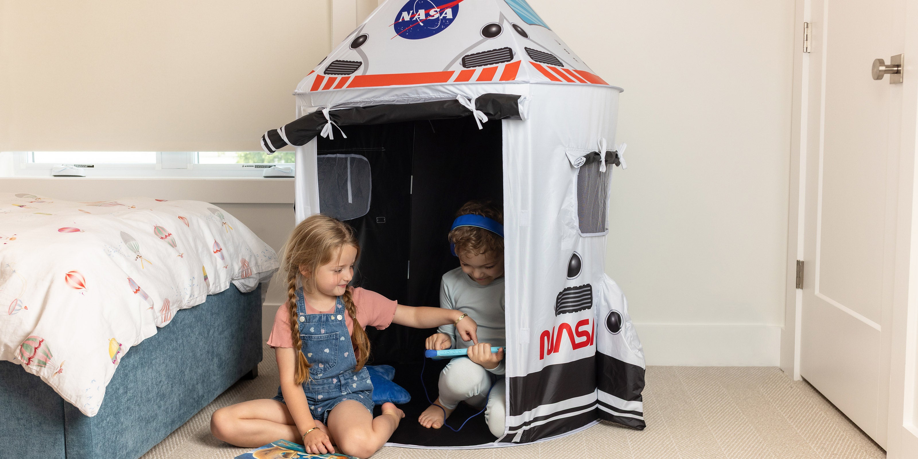 children playing in space tent