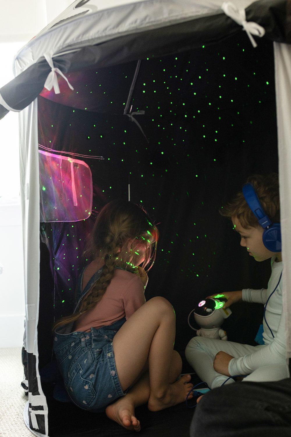Children playing in space tent